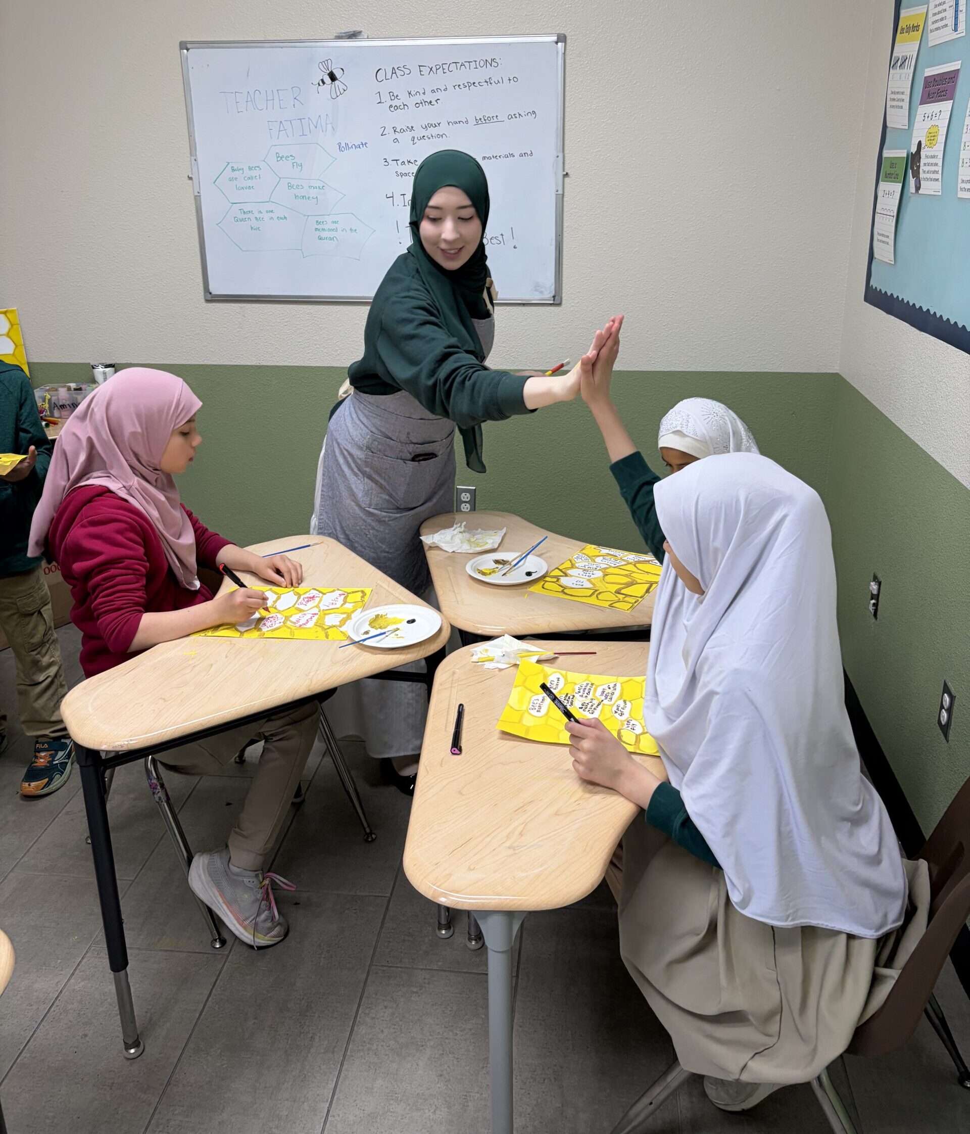 Strive teacher giving student a high-five