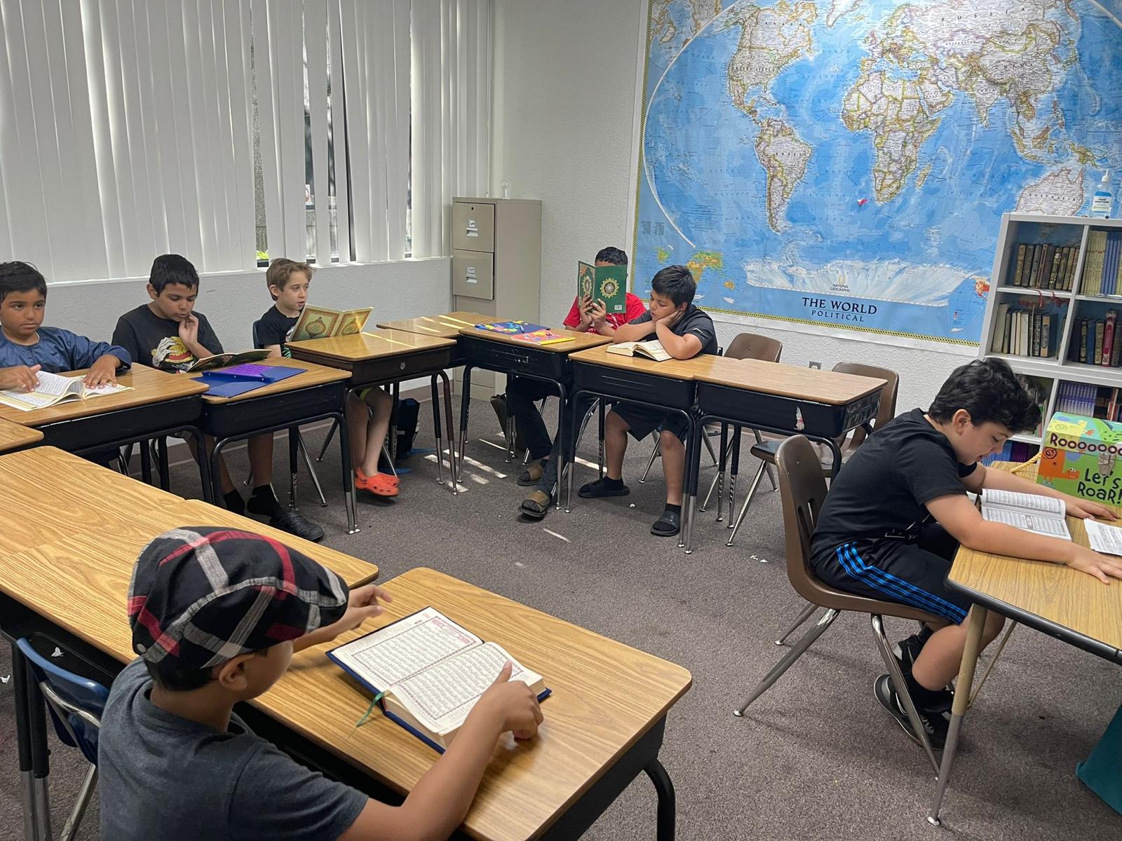 2022 Summer Camp students reading Qur'an